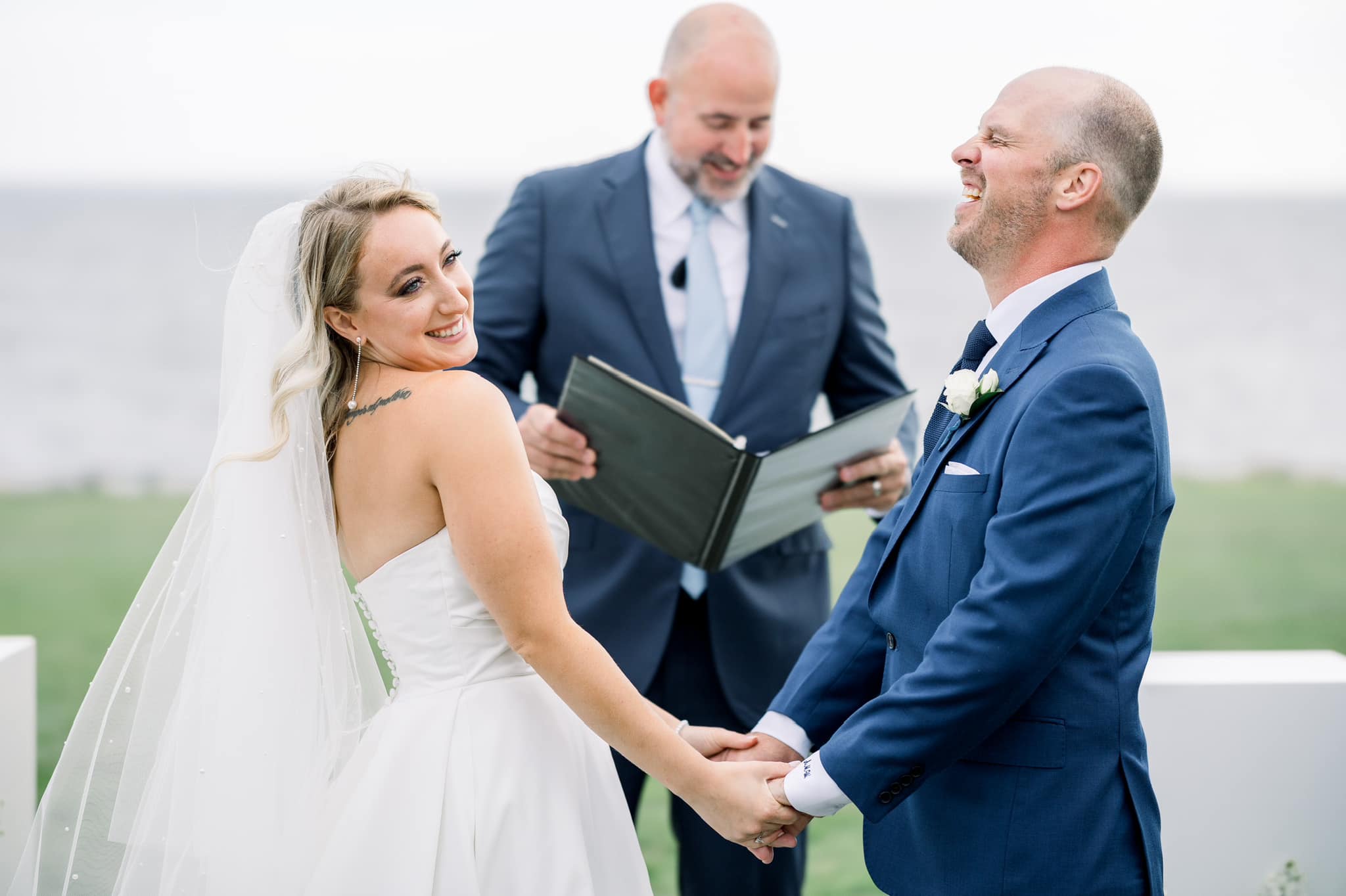 Officiant with a lavalier mic leading a wedding ceremony